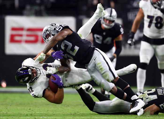 Sep 13, 2021; Baltimore Ravens fullback Patrick Ricard (42) is brought down by Las Vegas Raiders linebacker Denzel Perryman (52). Mandatory Credit: Mark J. Rebilas-USA TODAY Sports